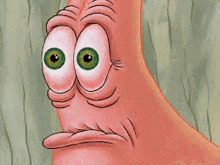 patrick star from spongebob squarepants is making a funny face with his big green eyes .