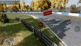 a stop sign is on the side of a race track in a video game