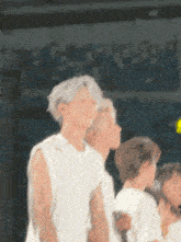 a blurry picture of a group of people standing in front of a crowd