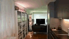 a living room with a lot of bookshelves and a tv