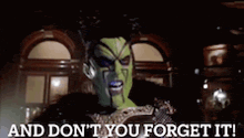 a man with a green face says " and don 't you forget it "