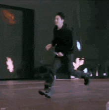 a man is kicking a large purple balloon in the air .