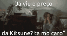 a man is sitting on a bed with his hands on his head and the words " ja viu o prego da kitsune ta mo caro "