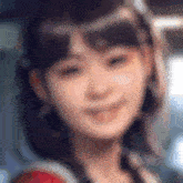 a blurry picture of a woman 's face with a smile