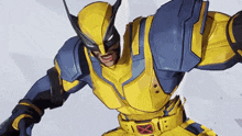 a close up of a superhero in a yellow and blue suit with a mask on .