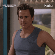 a man is wearing a tank top that says va