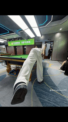 a pool table with a sign that says vip