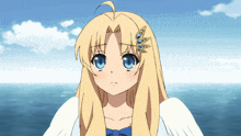 a girl with blonde hair and blue eyes is standing in front of a body of water