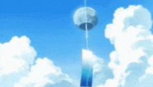 a wind chime against a blue sky with white clouds