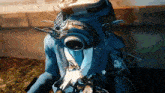 a person wearing a suit and tie with a gas mask on their head .
