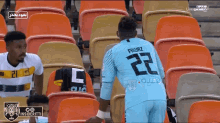 a soccer player with the number 22 on their jersey