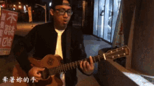 a man is playing a guitar with a route 66 logo on it