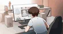 a man is sitting at a desk in front of a computer screen