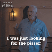 a man in a blue shirt says i was just looking for the pisser