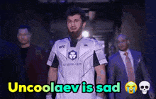 a man in a ufc jersey is walking down a hallway