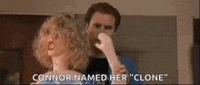 a man is holding a doll with the words " connor named her " written on it