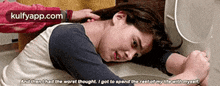 a girl is laying on the floor with the words kulfyapp.com on the bottom left