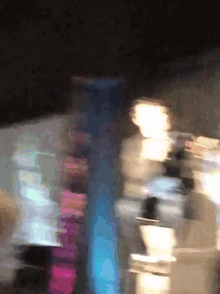 a blurry picture of a person standing in front of a building
