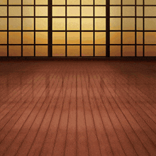 a room with a wooden floor and large windows