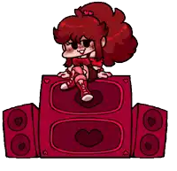 a girl is sitting on top of a red speaker with a heart on it .