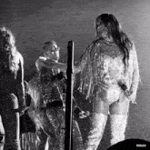 a black and white photo of a woman holding a microphone with the letters rbd3d on the bottom