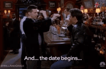 two men are sitting at a bar and one of them is saying and the date begins