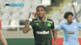 a soccer player wearing a shirt that says novibet on it