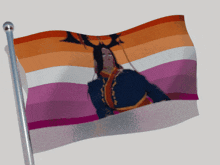 a flag with a picture of a deer on it is waving in the wind