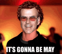 a picture of a man with curly hair and the words it 's gonna be may on the bottom