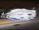 a pixelated image of a white object floating in the air on a table .