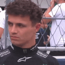 a young man wearing a hilton for the stars shirt