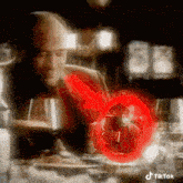 a man is sitting at a table with a glass of wine and a red circle around him .