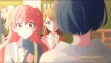 a girl with red hair is looking at another girl with blue hair