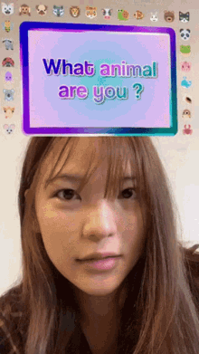 a woman 's face is behind a screen that says what animal are you