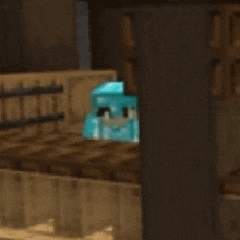 a minecraft character is sitting on top of a wooden table in a room .