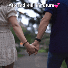 a man and a woman holding hands with the words atb and kiki in future