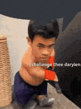 a man without a shirt is boxing with the words i challenge thee daryien above him