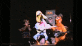 a duck playing a guitar and a rabbit playing a guitar with mousesteps.com written on the bottom