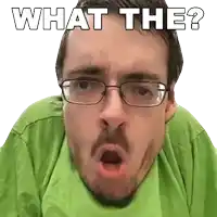 a man wearing glasses and a green shirt is asking " what the "
