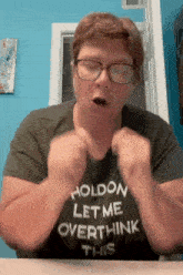 a woman wearing glasses and a holdon let me overthink this t-shirt