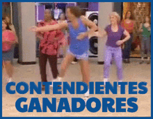 a group of women are dancing with the words contendientes ganadores in the background
