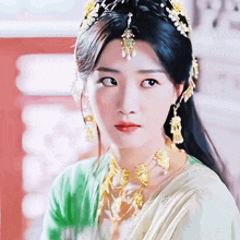 a close up of a woman 's face wearing a crown and earrings