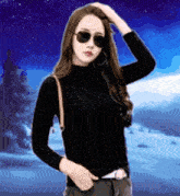 a woman wearing sunglasses and a black turtleneck is standing in front of a snowy forest