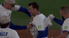 a baseball player named burger is being helped off the field
