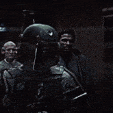 boba fett is holding a gun in front of a window