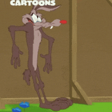 a cartoon of coyote standing in front of a sign that says " cartoons "