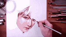 a person is drawing a man 's face with a pencil that says ' prismacolor ' on it