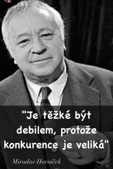 a black and white photo of a man in a suit and tie with a quote from miroslav hornicek