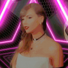 a woman in a white dress is standing in front of a pink triangle