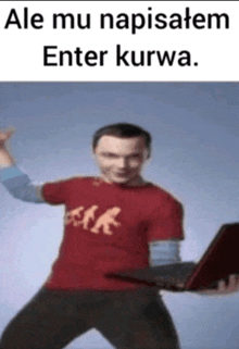 a man in a red shirt is holding a laptop and says " ale mu napisałem enter kurwa "